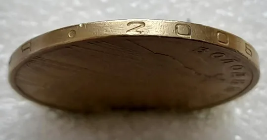 Купити (4682) 1 гривня 2006 різновид викрошки у цифрі "2" слова "2006" на гурті (1 гривна 2006 брак)