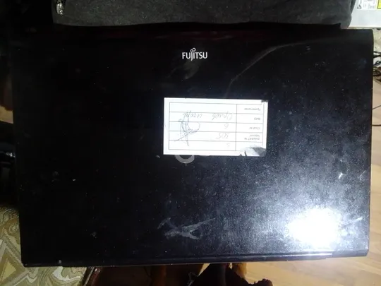 Купити ноутбук fugitsu ah532 вид на фото.на запчастини.проц э. залитий був.