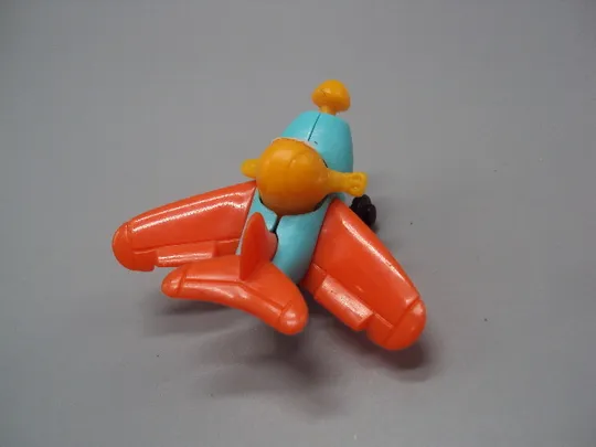 Фигурка киндер сюрприз самолет с глазками Disney самолетик бежит №18590м Де купити