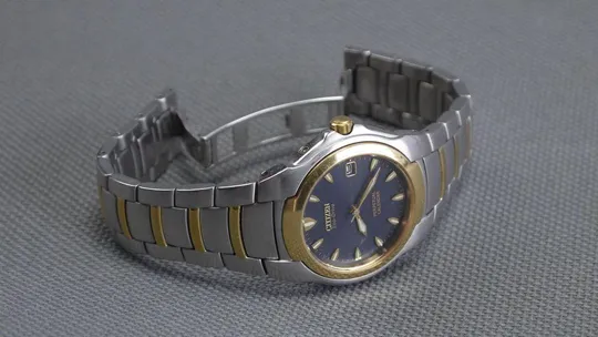 CITIZEN Eco-Drive Perpetual Calendar 100м. цельнолитая нержавейка синий циферблат model:E710-H24385T З аукціону