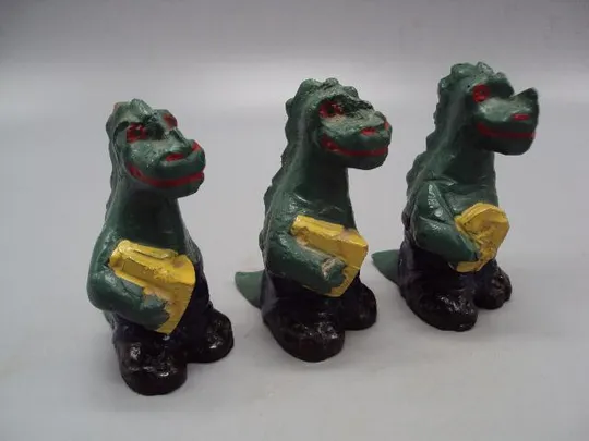 Игрушка фигурка динозавр с книгой колкий пластик высота 9,8 см лот 3 шт №9998 Ціна