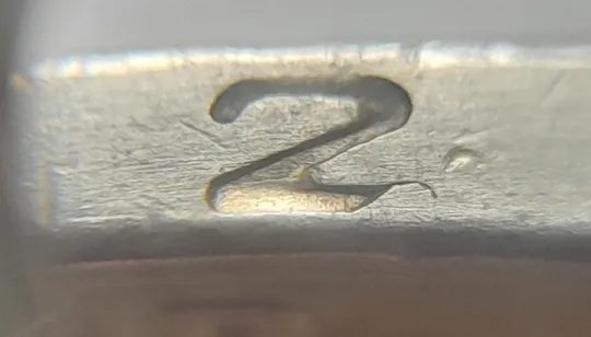 (4716) 1 гривня 2006 різновид викрошки у цифрі "2" слова "2006" на гурті (1 гривна 2006 брак) Ціна