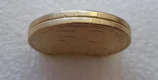 (3086) 50 копійок 1994 1.1АЕм, 1.2АЕм схожі викрошки на вінку між 7 та 8 гр. - 2 монети одним лотом (50 копеек 1994) Інтернет-аукціон