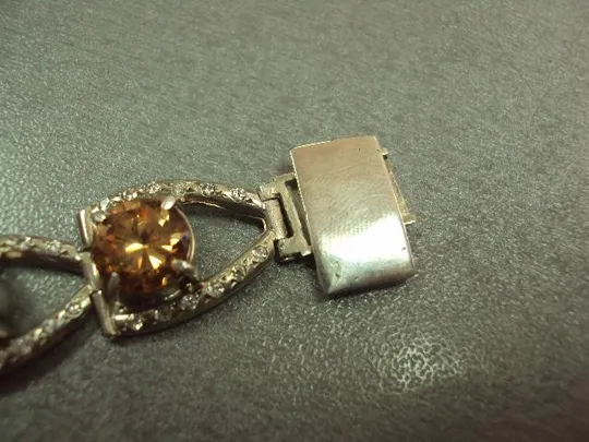 Женский браслет с оранжевыми желтыми и белыми вставками серебро 925 проба украина вес 34,34 г 18 см З аукціону