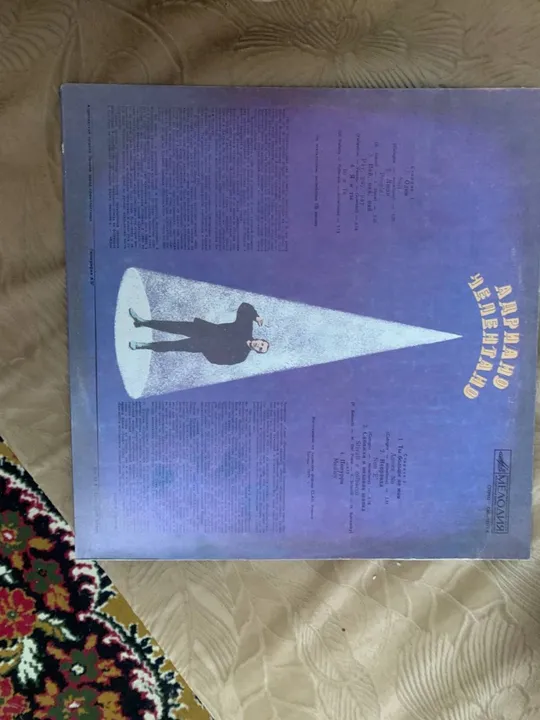 Адриано челентано З аукціону