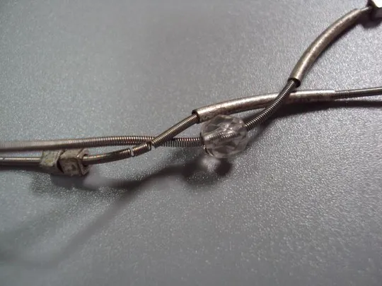 Бижутерия браслет посеребрение с подвеской голубь тянется на пружине №10841 Продаж