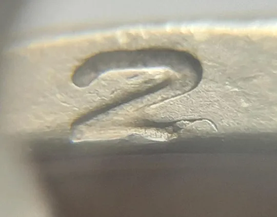 (4674) 1 гривня 2006 різновид викрошки у цифрі "2" слова "2006" на гурті (1 гривна 2006 брак) З аукціону