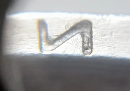 (5717) 1 гривня 2005 викрошка в букві "И" слова "ГРИВНЯ" на гурті (1 гривна 2005 брак викрошка) З аукціону