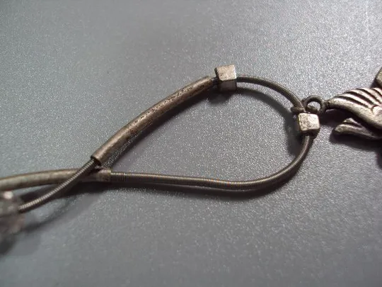 Бижутерия браслет посеребрение с подвеской голубь тянется на пружине №10841 З аукціону