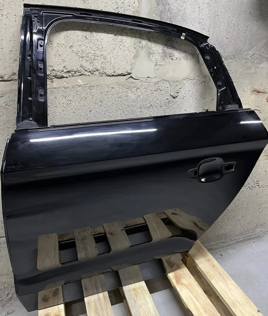 Задні ліві двері б/у Audi A3 2012-2016 sedan модель 8VS58L Ціна