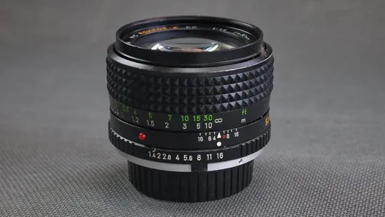 объектив Minolta MD Rokkor-X PG 50mm/1.4 MC Ф55мм на полный кадр (24x36mm) Де купити