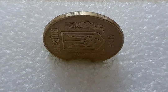 (3586) 25 копійок 2010 &quot;око&quot;, викрошка в році випуску (25 копеек 2010 глаз брак) З аукціону