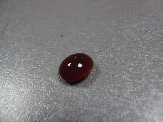 Камень коричнево-оранжевый овальный для ювелирных изделий вес 0,58 г №13253 Інтернет-аукціон