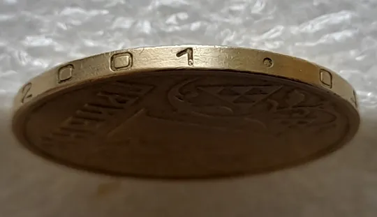 (1855) 1 гривня 2001 чотири викрошки на гурті ("Д", "И", "1", крапка - див. опис) (1 гривна 2001 брак) З аукціону