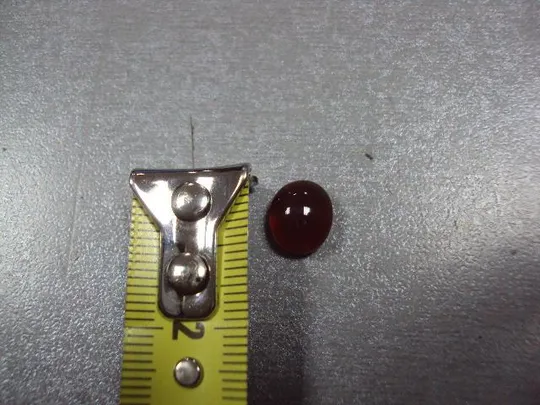 Камень коричнево-оранжевый овальный для ювелирных изделий вес 0,58 г №13253 З аукціону