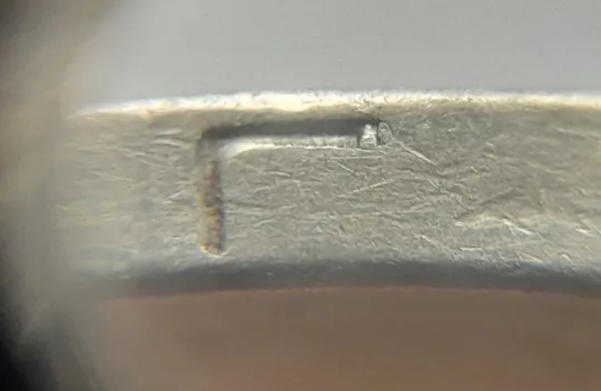 (4806) 1 гривня 2001 викрошки у "Г" слова "ГРИВНЯ" та у "2" слова "2001" на гурті (1 гривна 2001) Ціна