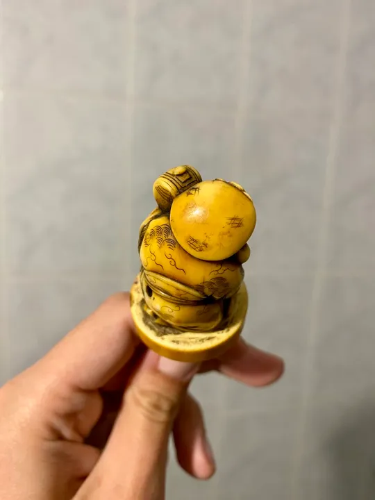 Антикварна японська статуэтка нецке Де купити