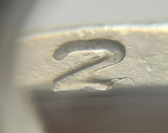 (4674) 1 гривня 2006 різновид викрошки у цифрі "2" слова "2006" на гурті (1 гривна 2006 брак) Ціна