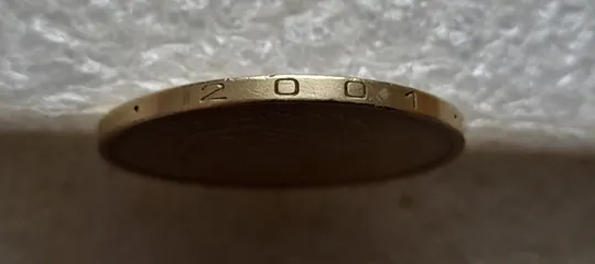 (7486) 1 гривня 2001 викрошка у букві "Д" слова "ОДНА" на гурті (1 гривна 2001 брак) Де купити