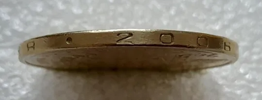 Купити (4718) 1 гривня 2006 різновид викрошки у цифрі "2" слова "2006" на гурті (1 гривна 2006 брак)