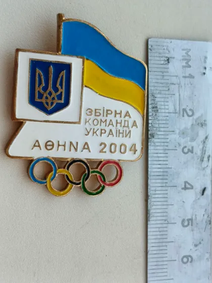 фото, Знак олімпійської збірної команди України на олімпіаді в Афінах 2004 рік