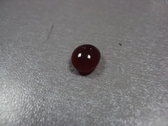 Камень коричнево-оранжевый овальный для ювелирных изделий вес 0,58 г №13253 Ціна