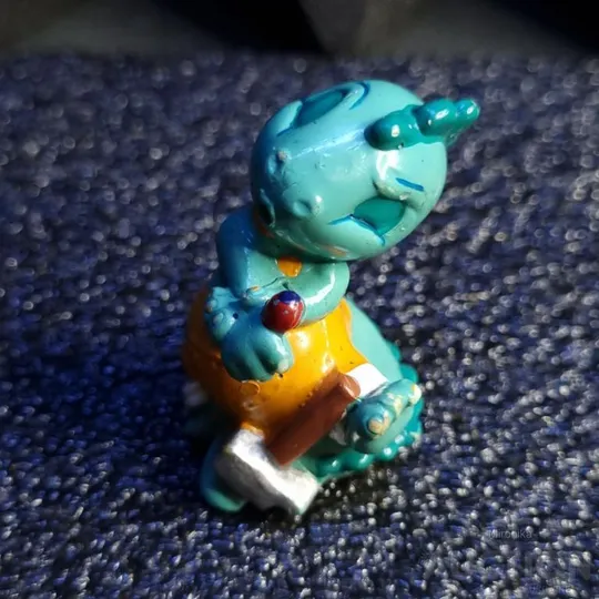 Фігурка Динозавр-будівельник з Кіндер Сюрприз (Ферреро), 1995 рік. Ціна