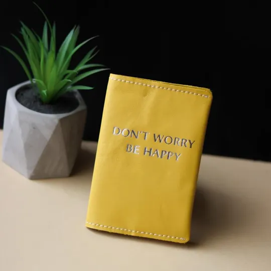 Купити Обкладинка для паспорта &quot;Don&#039;t Worry Be Happy&quot; жовта з посрібленням,біла нитка.
