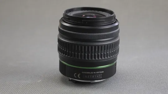 Об&#039;єктив SMC Pentax-DA AF 18-55mm 1:3.5-5.6 AL Ф52мм штатный зум для цифровыx камер Pentax Вживане Інтернет-аукціон