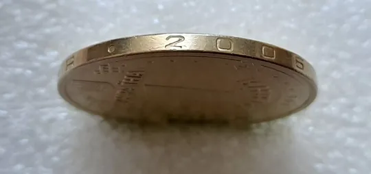 (5174) 1 гривня 2006 викрошки у букві "Г" слова "ГРИВНЯ" та цифрі "2" слова "2006" на гурті ( 1 гривна 2006 брак) Де купити