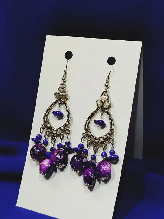 Сережки з фіолетовим камінням, довжина 6 см Ціна