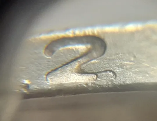 (4713) 1 гривня 2006 різновид викрошки у цифрі "2" слова "2006" на гурті (1 гривна 2006 брак) З аукціону