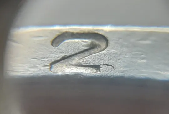 (5174) 1 гривня 2006 викрошки у букві "Г" слова "ГРИВНЯ" та цифрі "2" слова "2006" на гурті ( 1 гривна 2006 брак) З аукціону