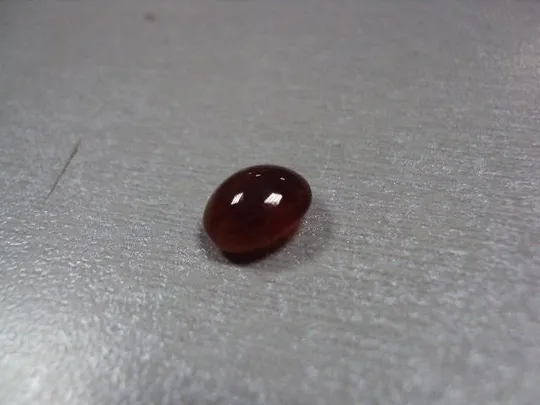 Купити Камень коричнево-оранжевый овальный для ювелирных изделий вес 0,58 г №13253