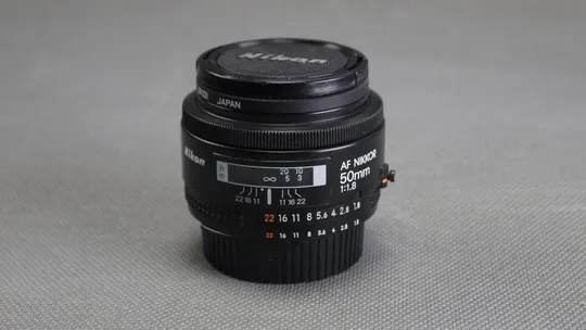 штатный объектив Nikon Nikkor AF 50mm f/1.8 Ф52mm на полный кадр 24x36mm З аукціону