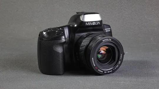 пленочный фотоаппарат Minolta Maxxum 300si + зум объектив Minolta Maxxum AF 35-80/3.5-4.5 Ф46mm Ціна