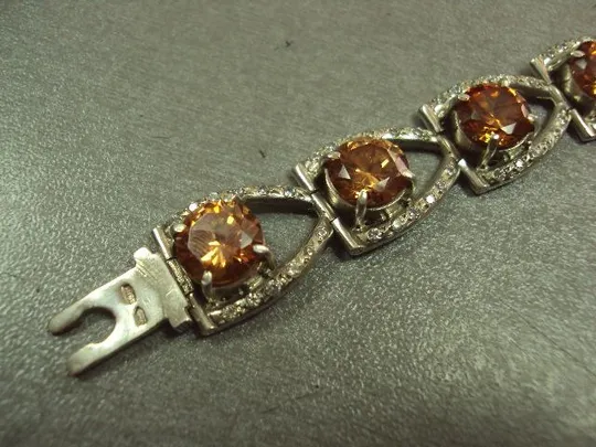 Женский браслет с оранжевыми желтыми и белыми вставками серебро 925 проба украина вес 34,34 г 18 см Інтернет-аукціон