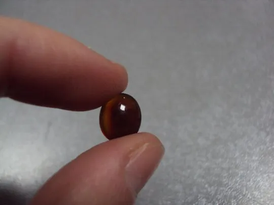 Камень коричнево-оранжевый овальный для ювелирных изделий вес 0,58 г №13253 Продаж